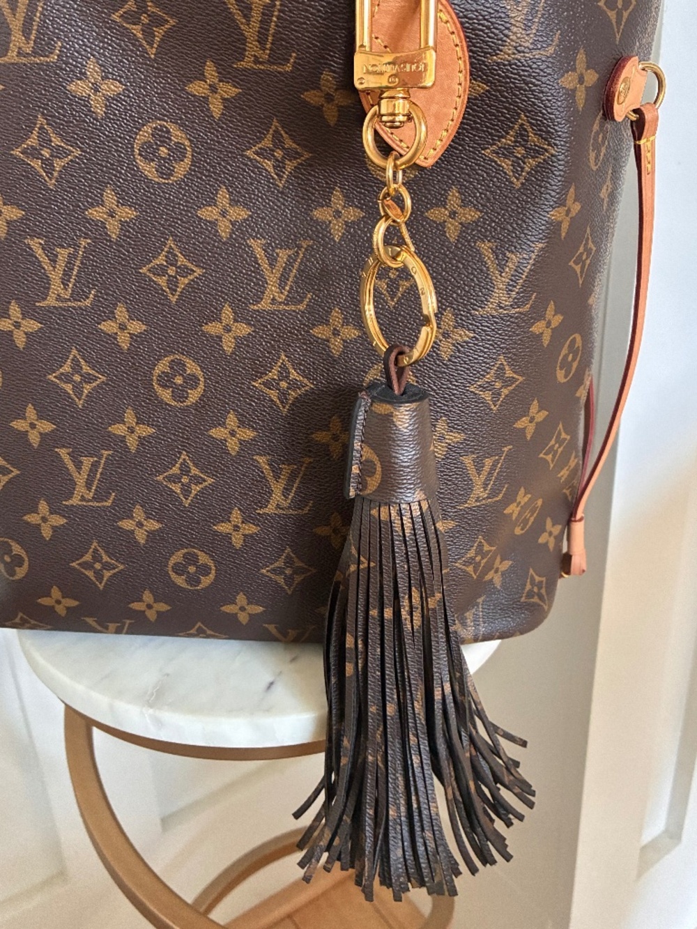 Louis Vuitton monogram canvas large tassel bag charm